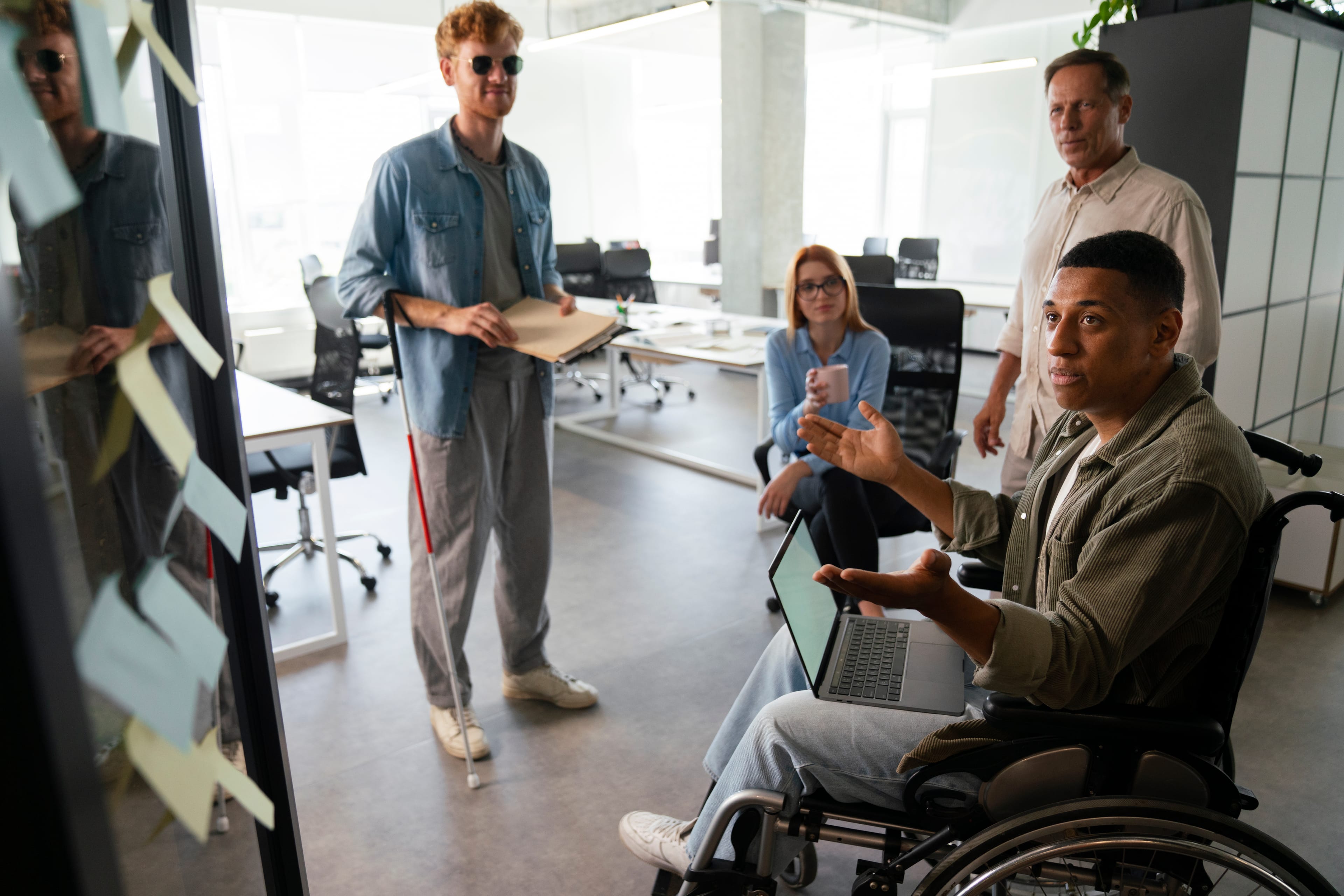 Person in wheelchair working in office environment